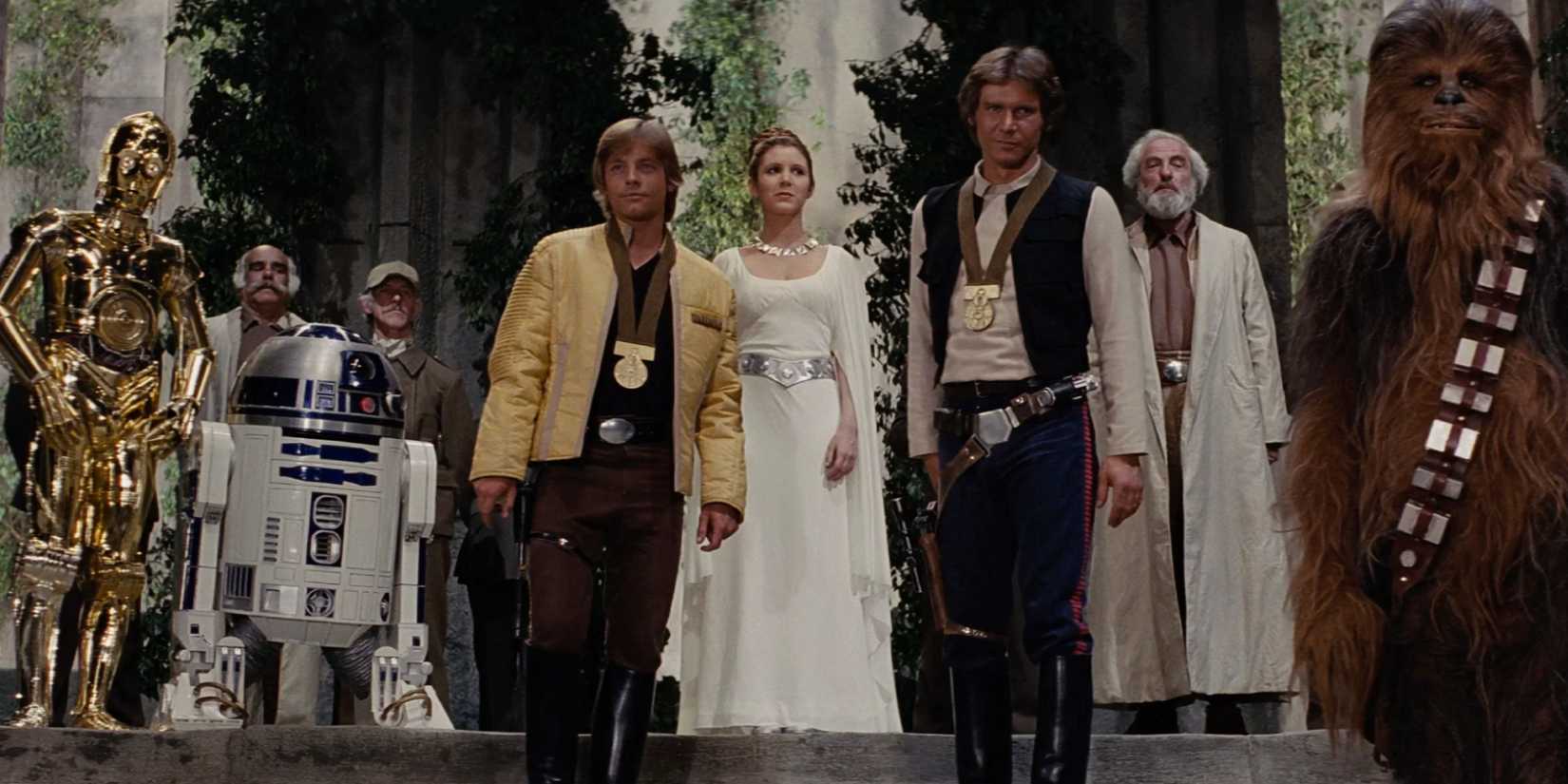 The ending of Star Wars with Leia rewarding Luke and Han