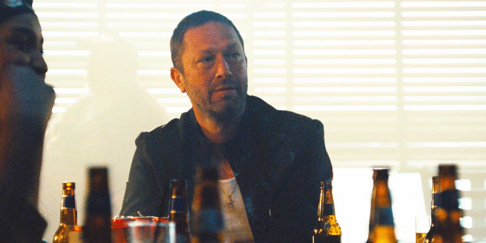 Ebon Moss-Bachrach as Richie sitting at a bar in the "Gary" episode of The Bear