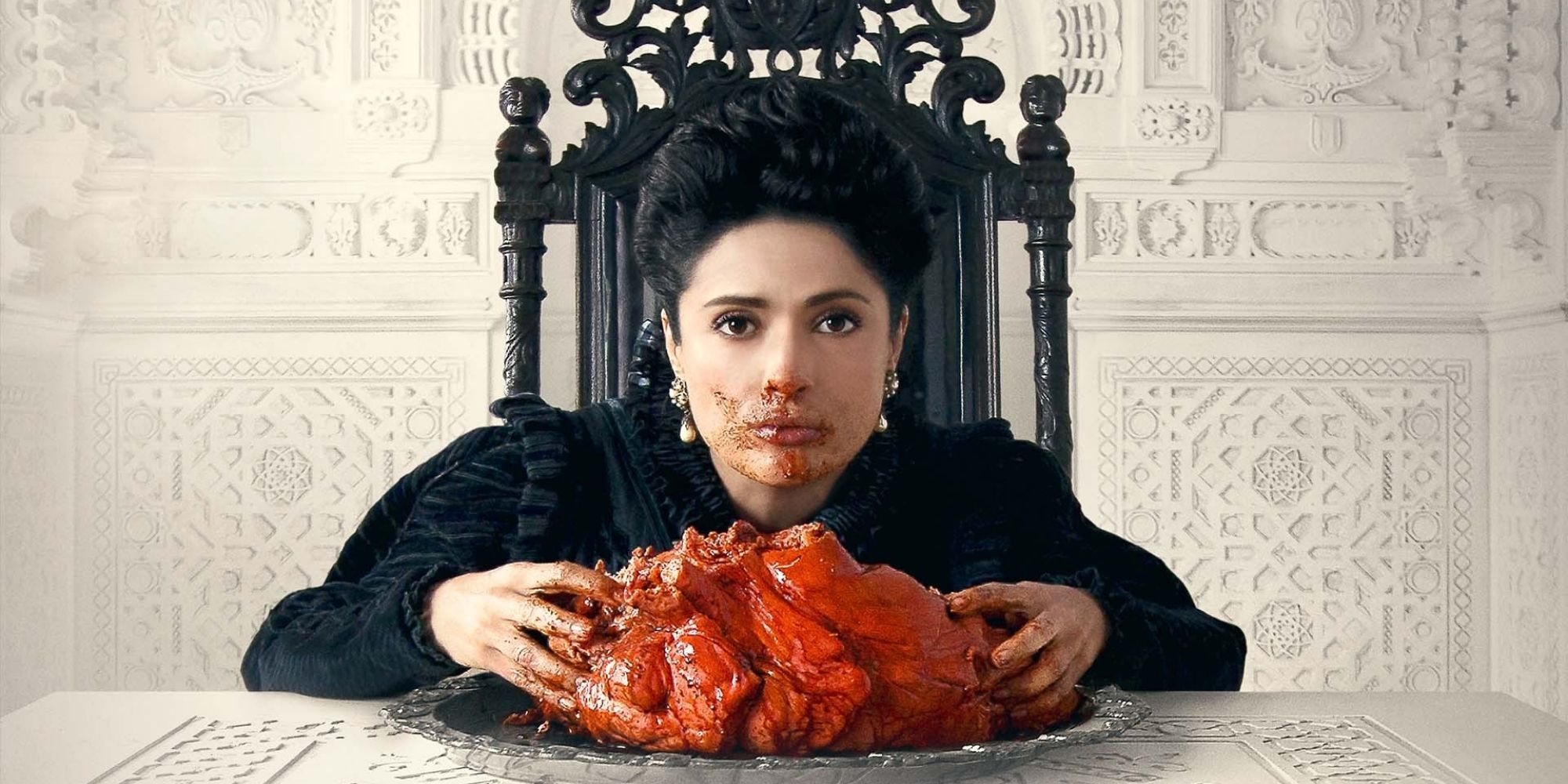 Salma Hayek eating a large heart in Tale of Tales