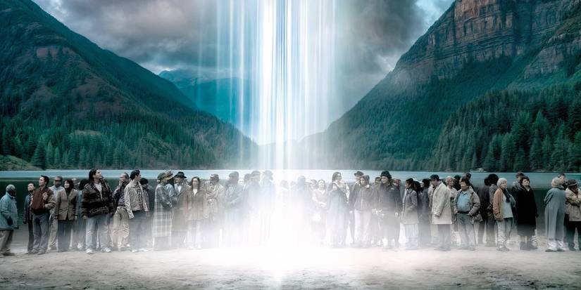Dozens of humans standing on a beach as alien light beams down from the sky in The 4400