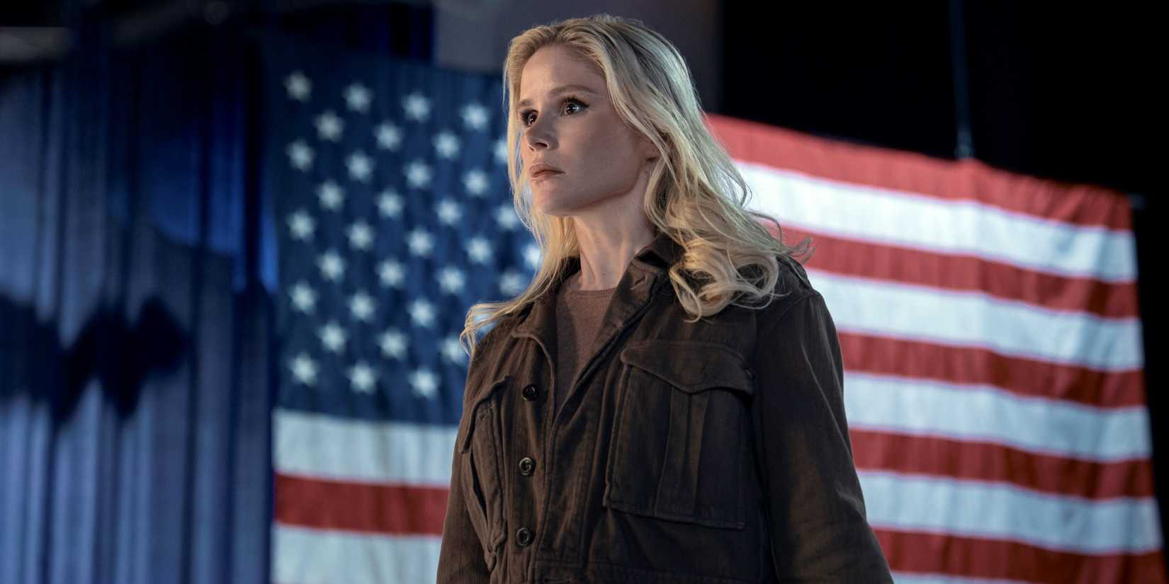 Erin Moriarty as Starlight standing in front of a giant American flag in The Boys Season 5