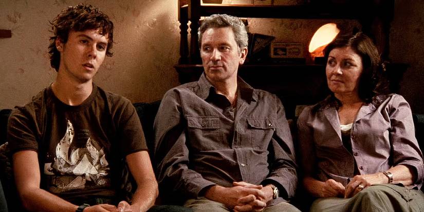The cast of Lake Mungo sitting on a couch and talking to the camera