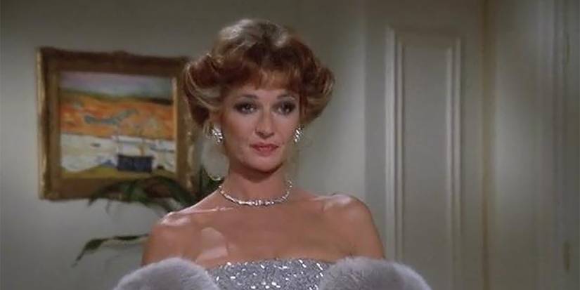 A woman dressed up inThe Colbys.