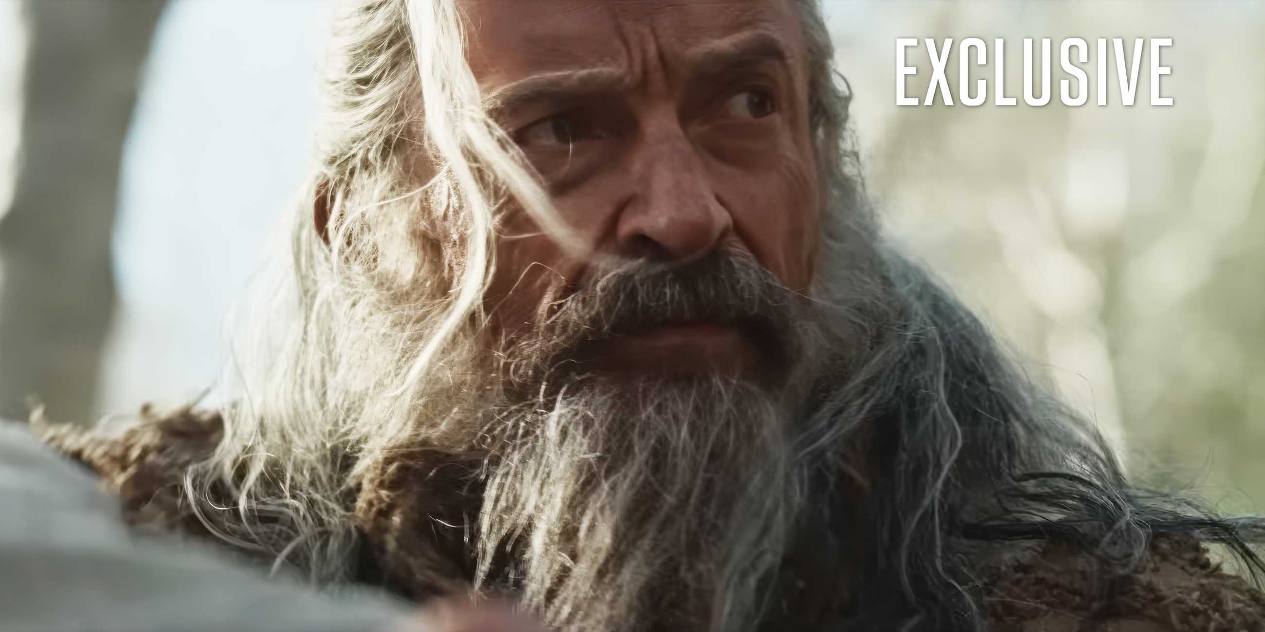 Hugh Jackman with a white beard and long hair in an exclusive image of The-Death-of-Robin-Hood