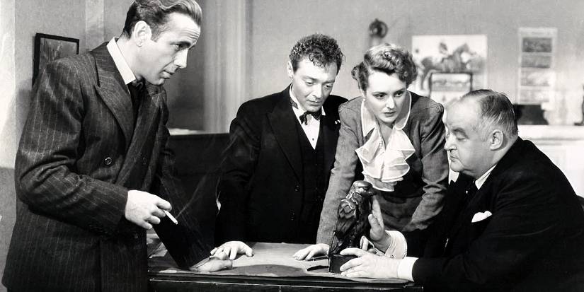 Sam Spade, Joel Cairo, Brigid O'Shaughnessy, and Kasper Gutman gathered around the Falcon statuette in The Maltese Falcon