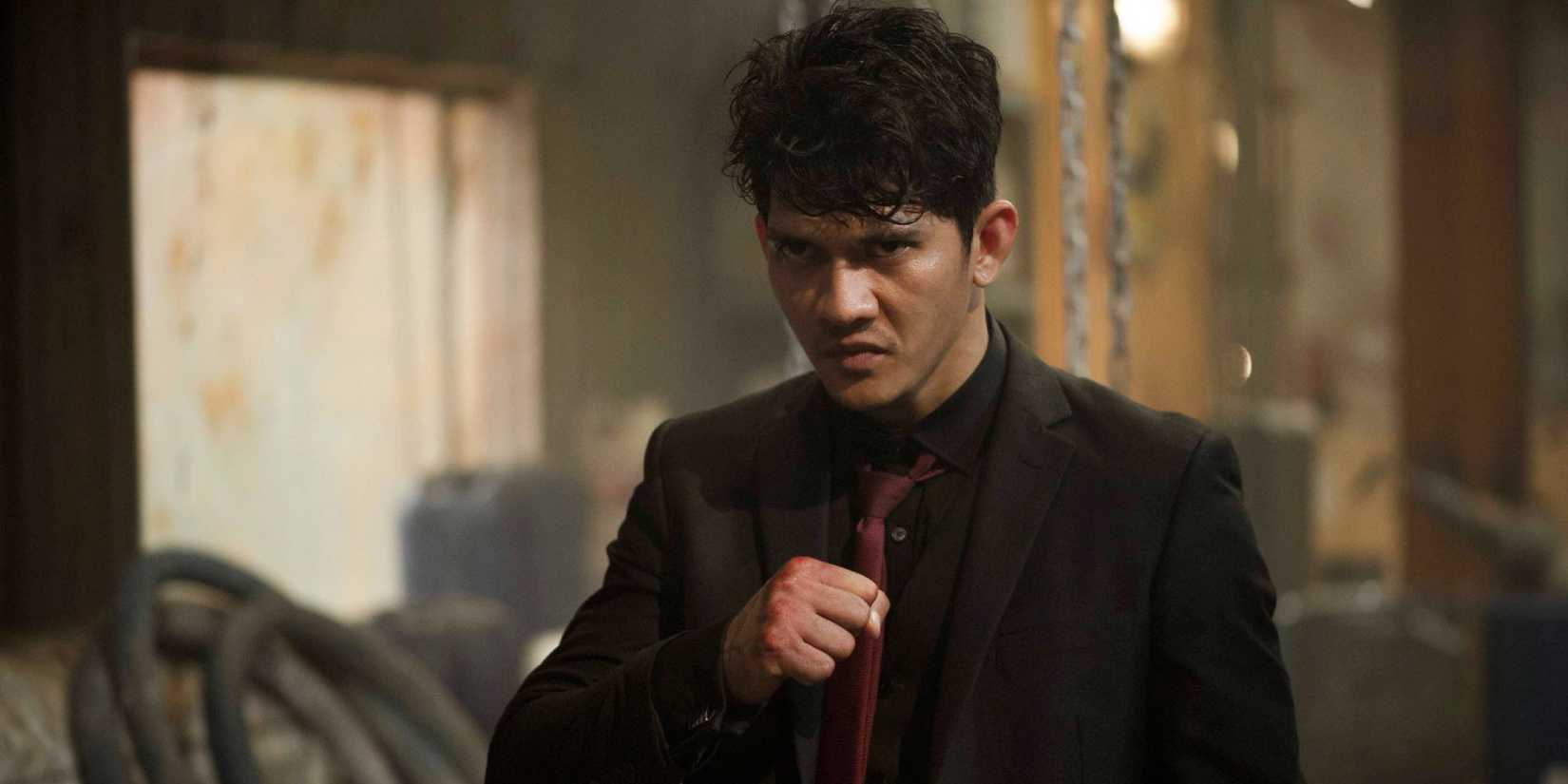 Iko Uwais in a fighting position in The Night Comes for Us - 2018