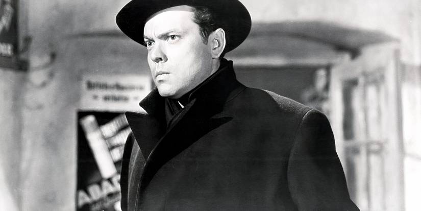 Harry Lime wearing a coat and hat and looking severe in The Third Man