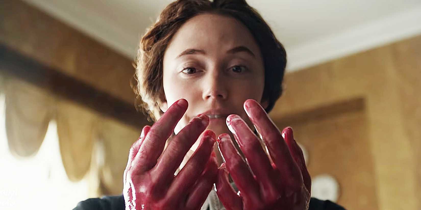 Maika Monroe staring at her bloody hands in Victorian Psycho