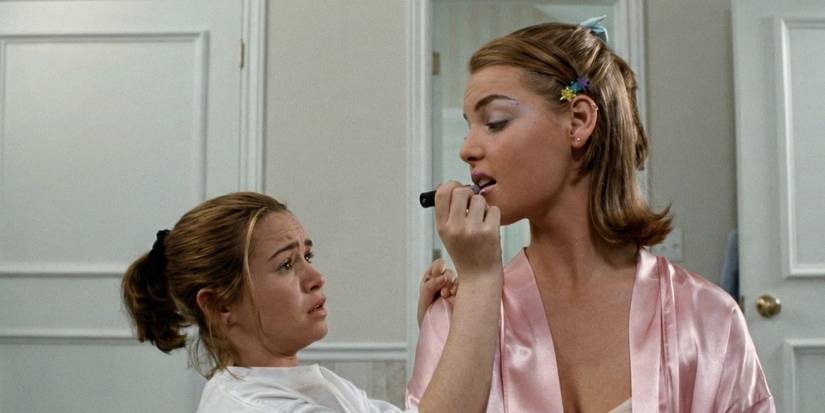 Danielle Harris as Hayley puts lipstick on Katherine Heigl as Alexia in Wish Upon a Star