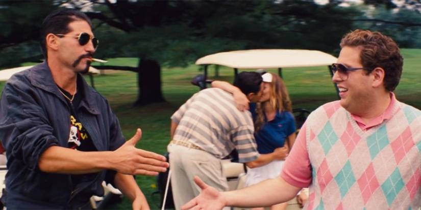 Brad (Jon Bernthal) and Donnie (Jonah Hill) nearly shaking hands on a golf course in 'The Wolf of Wall Street.'