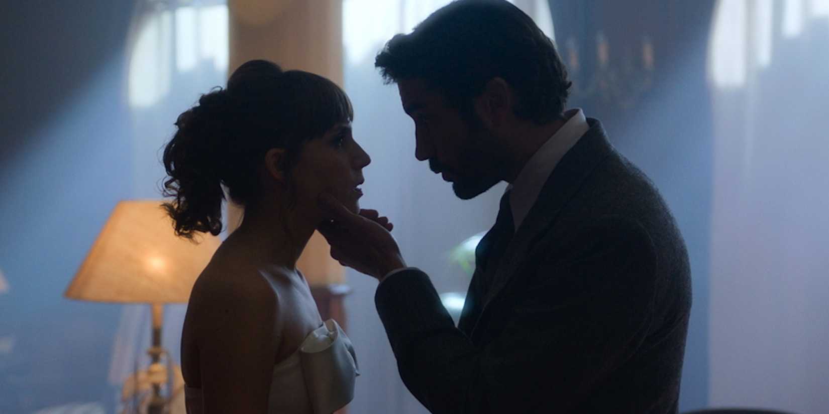 Marina (Aura Garrido) being held by a man in 'A Private Affair'