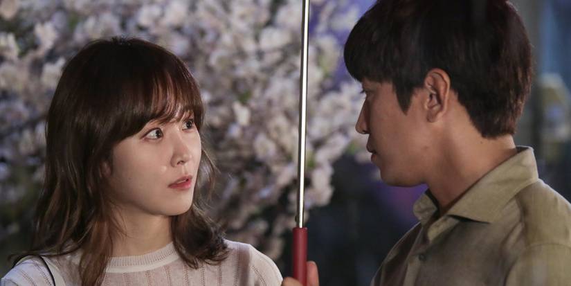 Seo Hyun-jin talking to Eric Mun who is holding an umbrella in Another Miss Oh