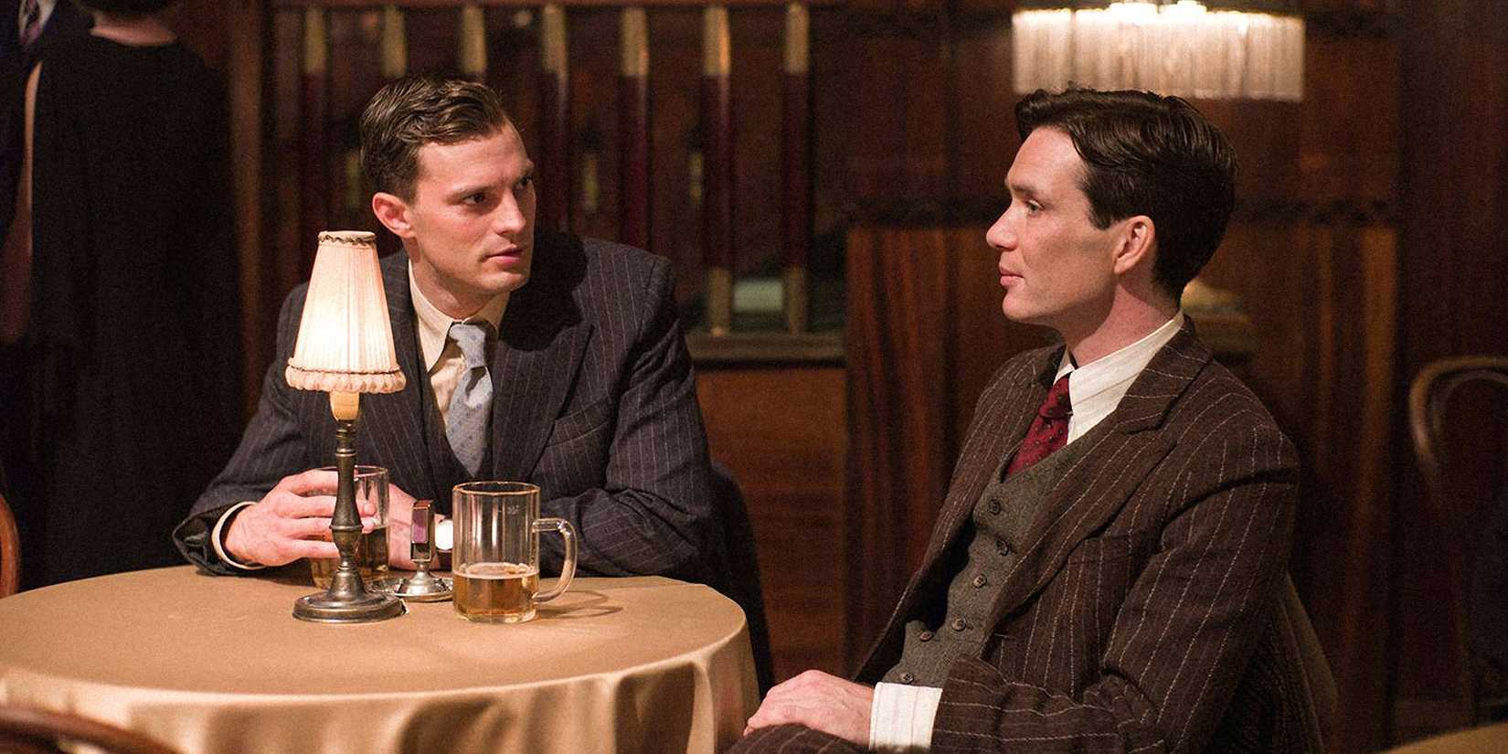 Jamie Dornan and Cillian Murphy sitting at a table in Anthropoid