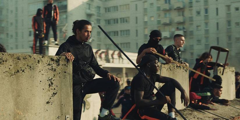 Protestors staking out a wall in the Netflix movie 'Athena'