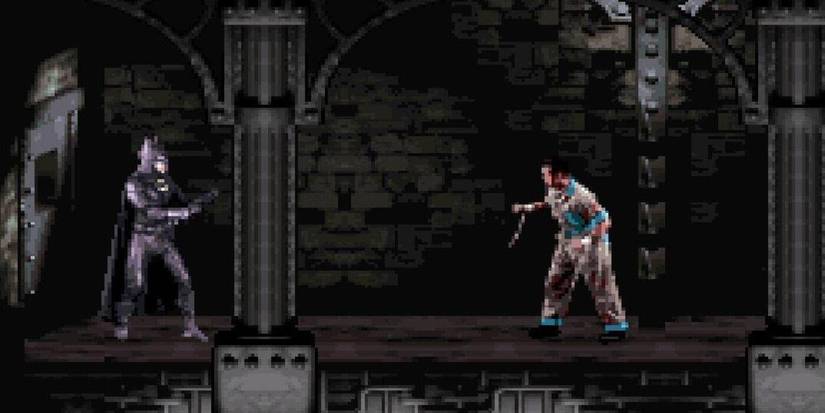 Batman about to get into a fight against a villain in a darkly lit room in the 'Batman Forever' video game for the SNES