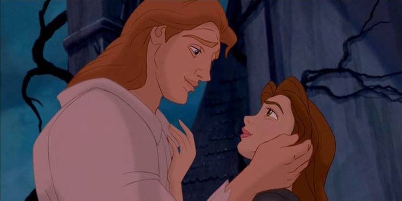 The Beast now in human form looks lovingly at Belle in the finale of Beauty and the Beast, 1991