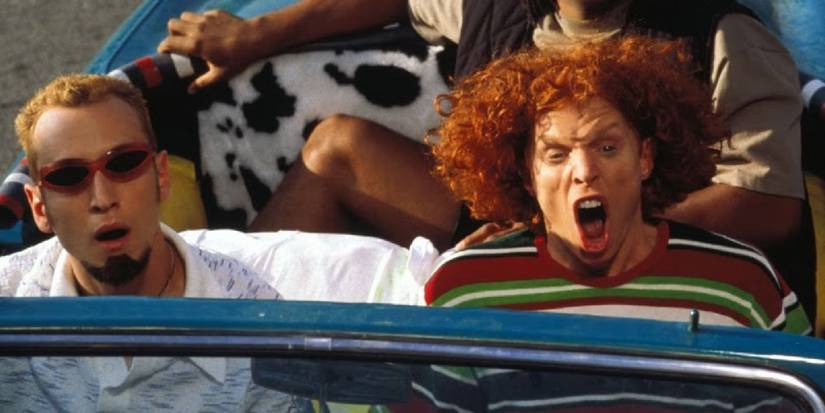 Two men in a car screaming in fear in Chairman of the Board - 1998