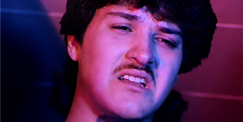 A man with clenched teeth and narrowed eyes in Things