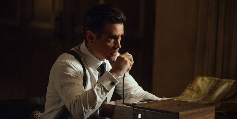 Colin Farrell as John Sugar, sitting down and talking into a microphone in Sugar Season 2.