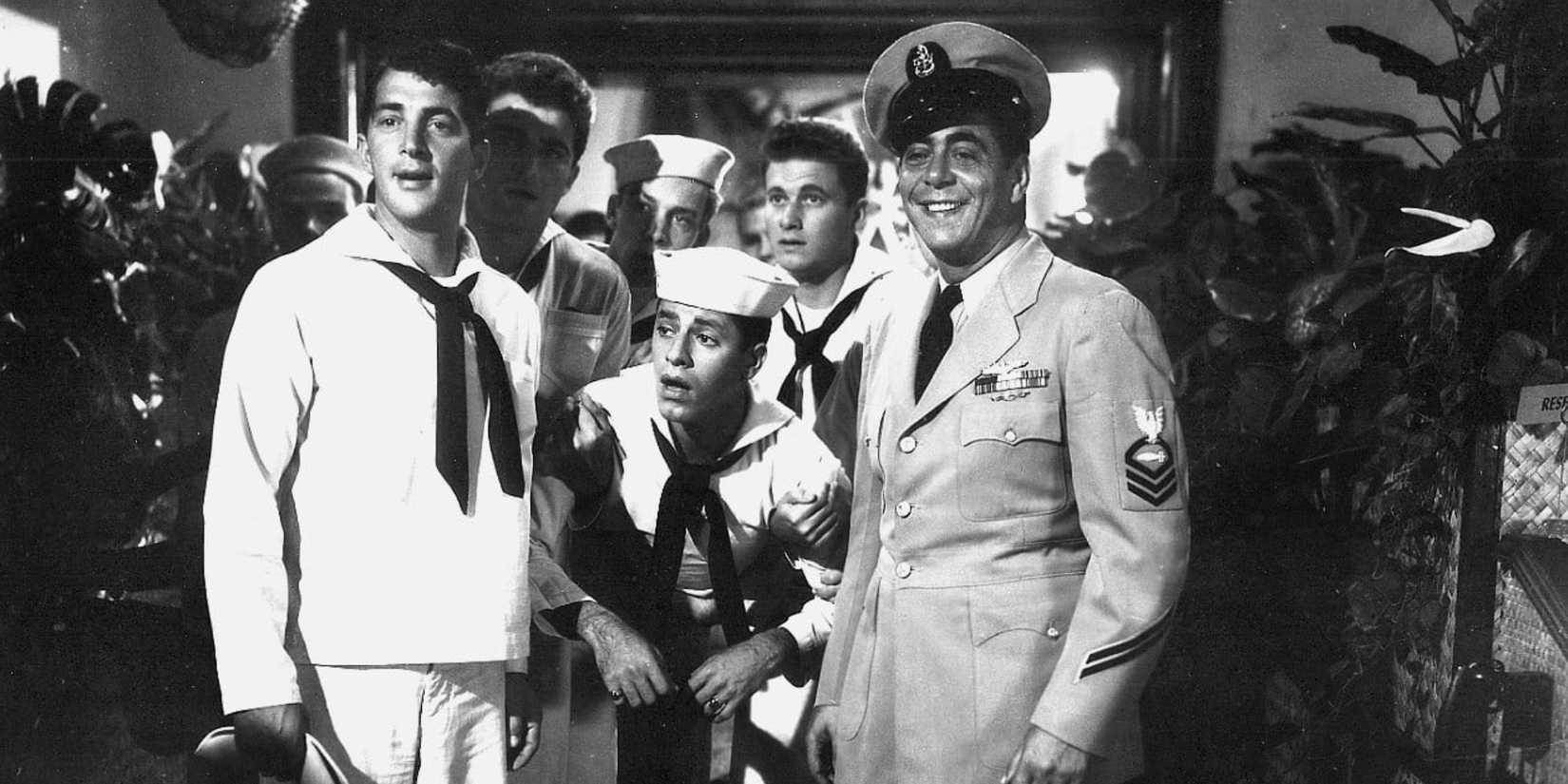 Dean Martin holding up Jerry Lewis with Robert Strauss in Sailor Beware (1952)