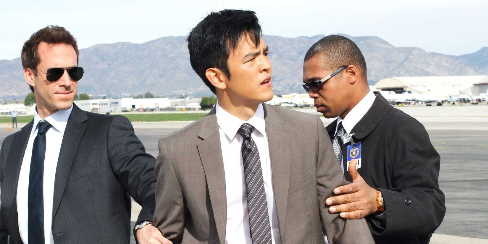 John Cho being held by two agents in the series 'FlashForward'