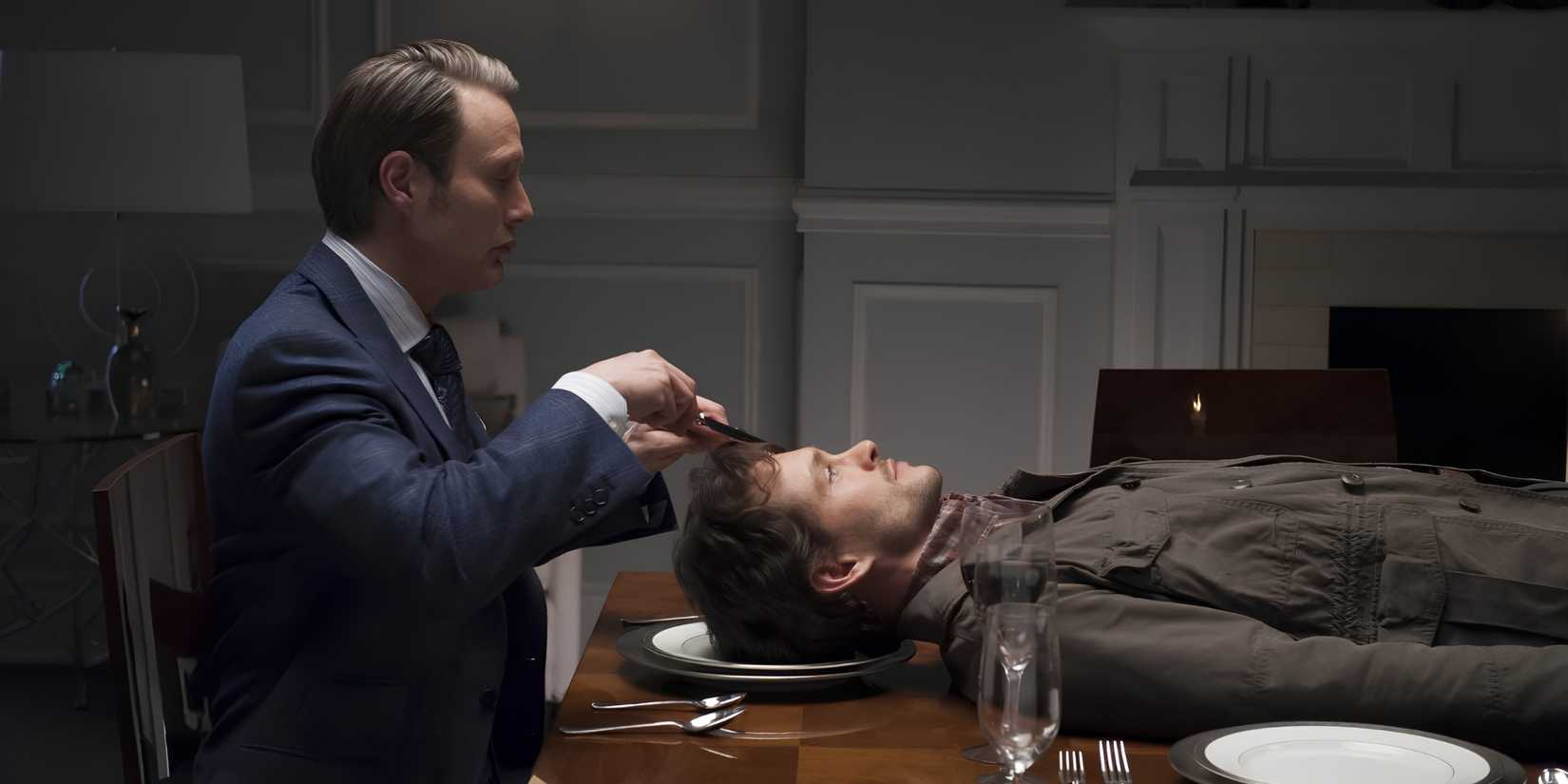 Hannibal Lecter (Mads MIkkelsen) prepares to cut open Will Graham's (Hugh Dancy) head on a dinner plate in Hannibal.