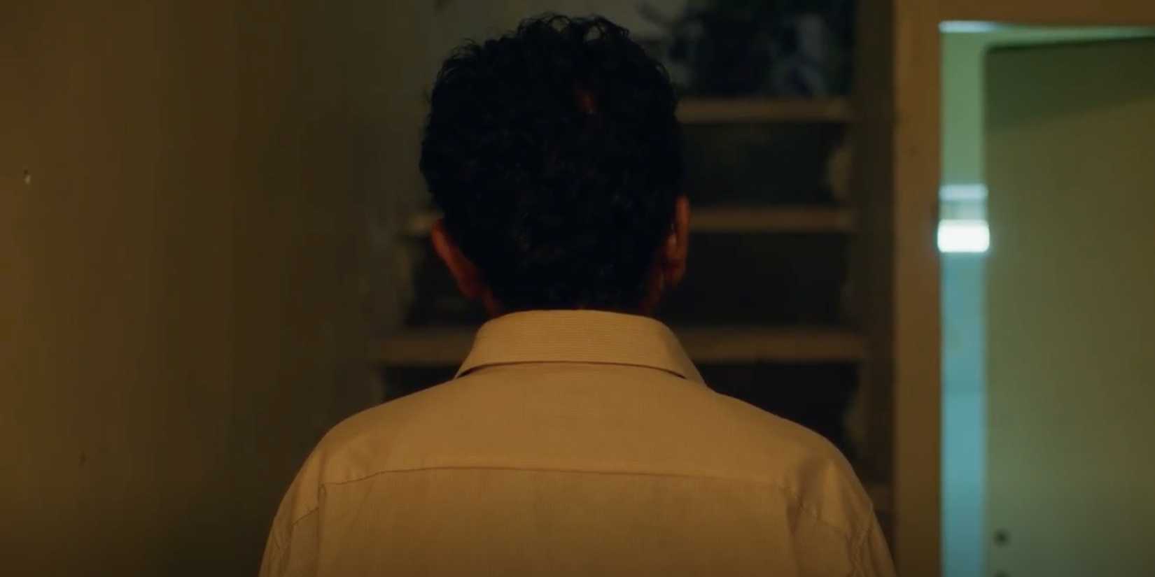 Vahid standing still with his back turned to the camera in It Was Just an Accident