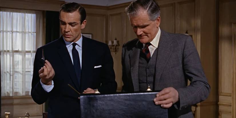 James Bond and Q looking at a black leather briefcase in From Russia With Love