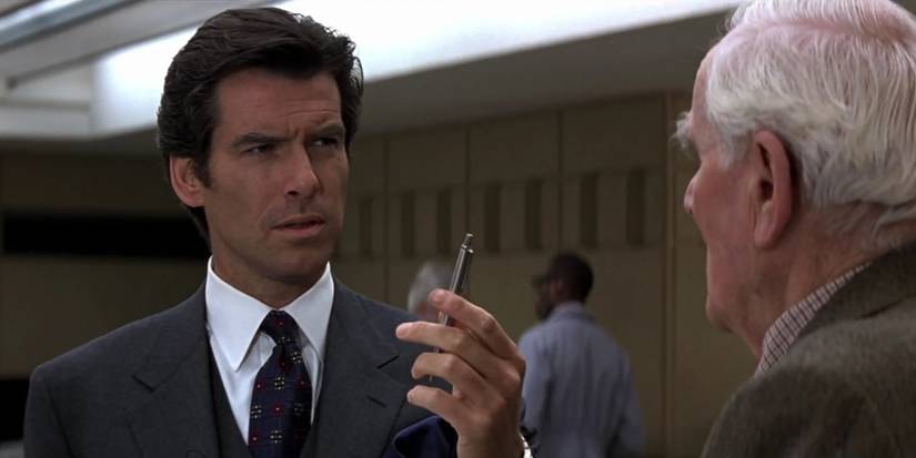 Pierce Brosnan holding a clicking pen in GoldenEye