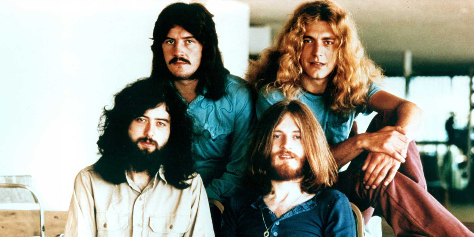 Led Zeppelin sitting together for a photoshoot