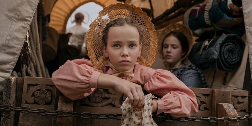 A girl in a wagon in 'Little House on the Prairie'