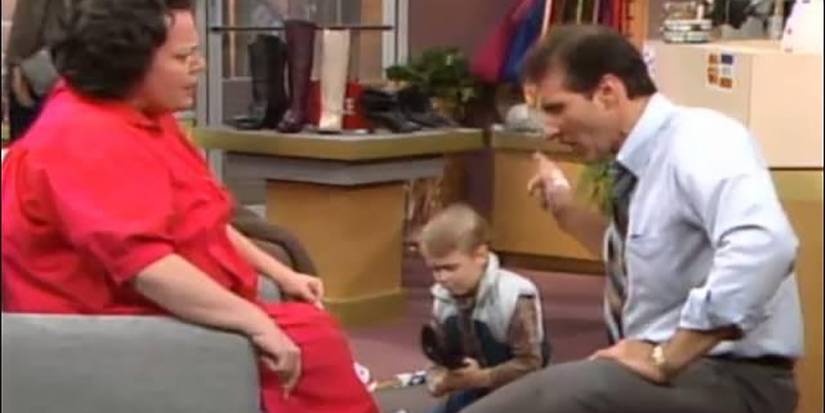 Al helping a woman in the shoe store in Married...With Children.