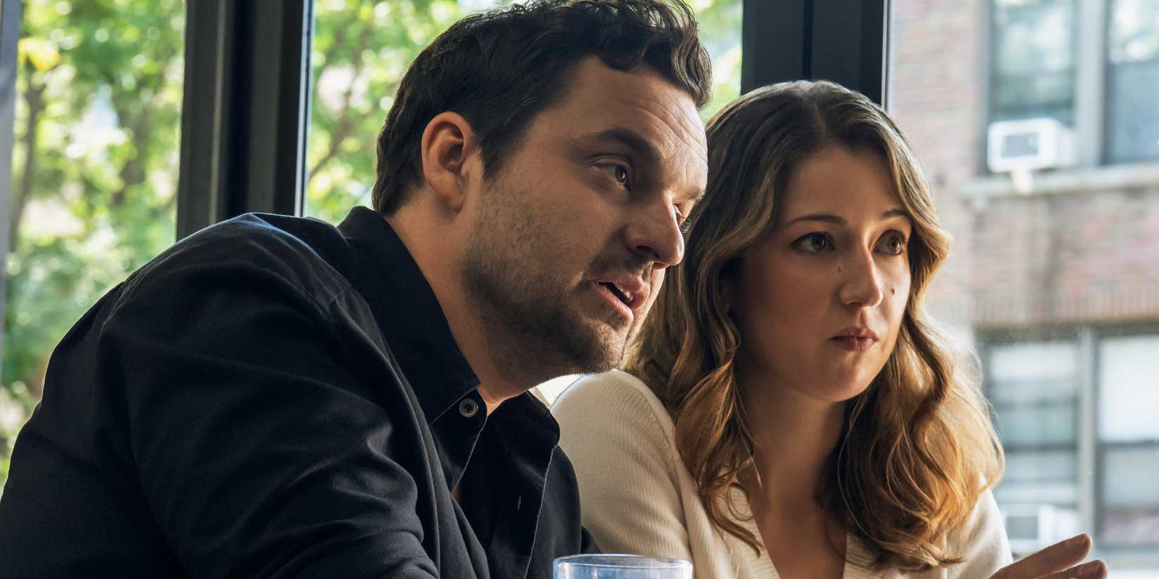 Jake Johnson and Jessy Hodges talking seriously at a restaurant in Maximum Pleasure Guaranteed