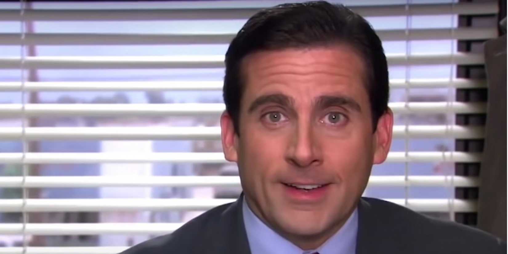Michael (Steve Carell) in his office, smiling, in The Office.