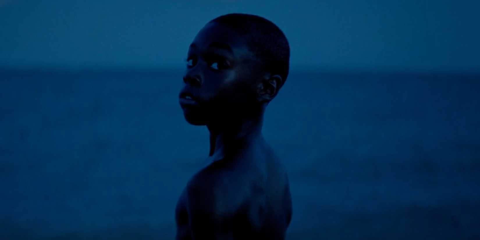 Little looking at the camera in the moonlight in Moonlight