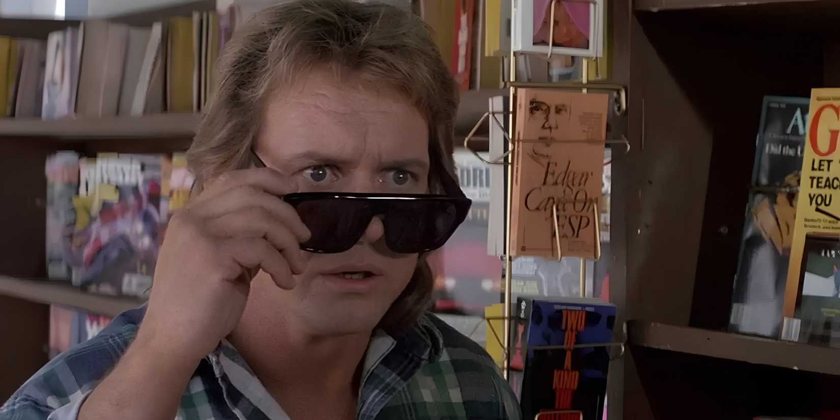 Nada (Roddy Piper) tries sunglasses for the first time in They Live.