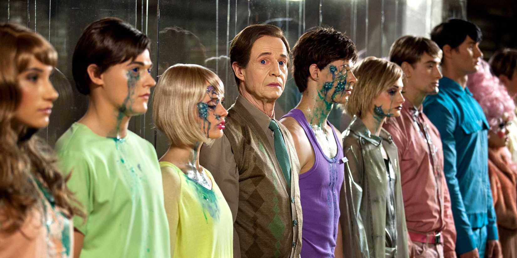 A row of hubots with one looking at the camera in 'Real Humans'