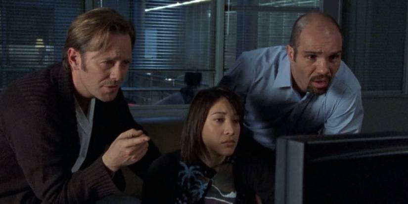 Three characters looking at something in 'ReGenesis'