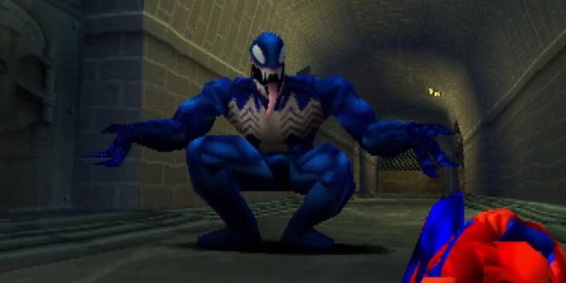 Venom standing over Spider-Man in Spider-Man (2000)