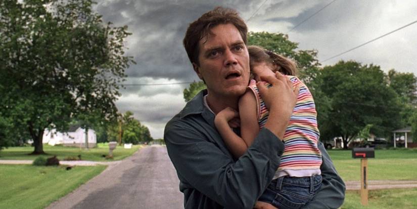 Michael Shannon holding a little girl in 'Take Shelter'