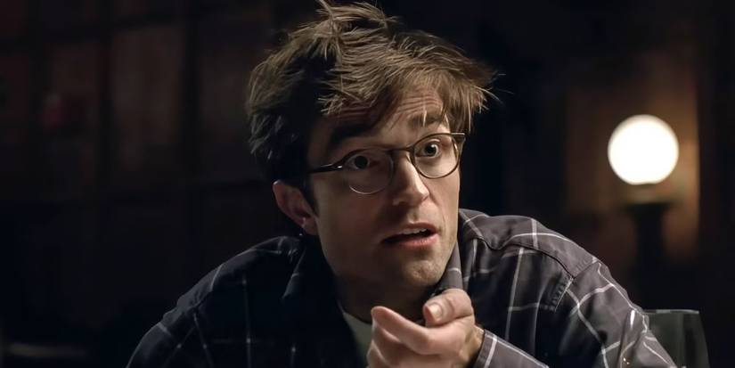 Robert Pattinson looks shocked at dinner in The Drama