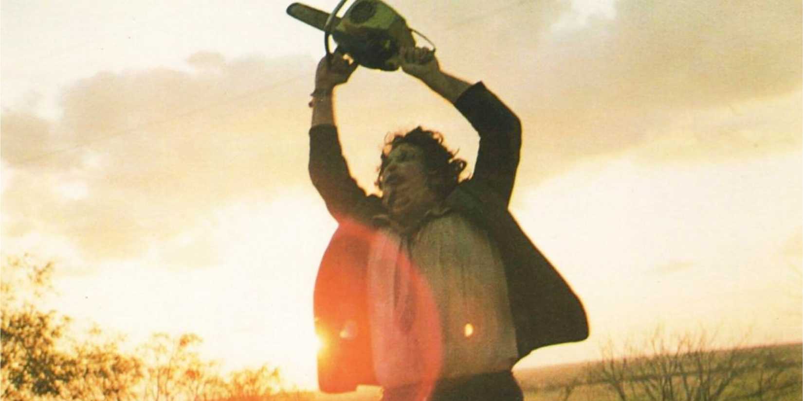 Leatherface raising his chainsaw in The Texas Chain Saw Massacre