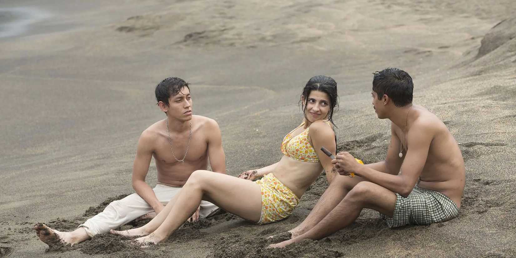 Two men and a woman on the beach in 'I Dream In Another Language'