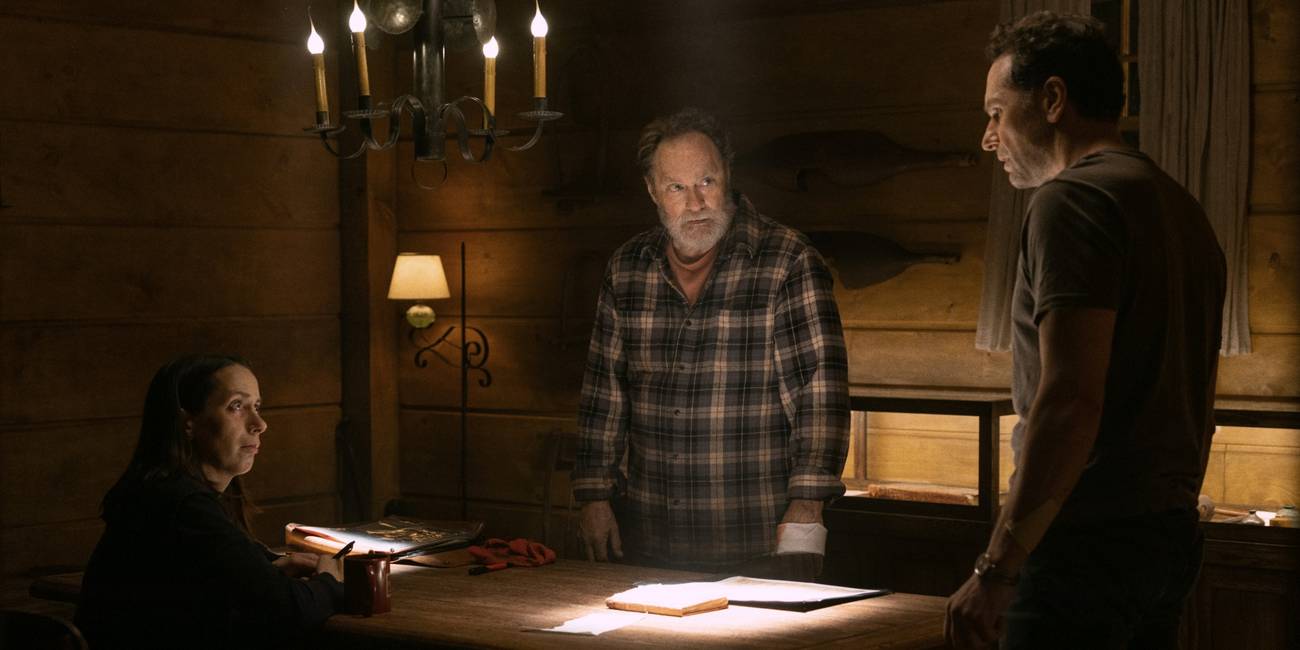 Matthew Rhys as Tom, Stephen Root as Wyck, and Kate O'Flynn as Patricia around a table in Widow's Bay