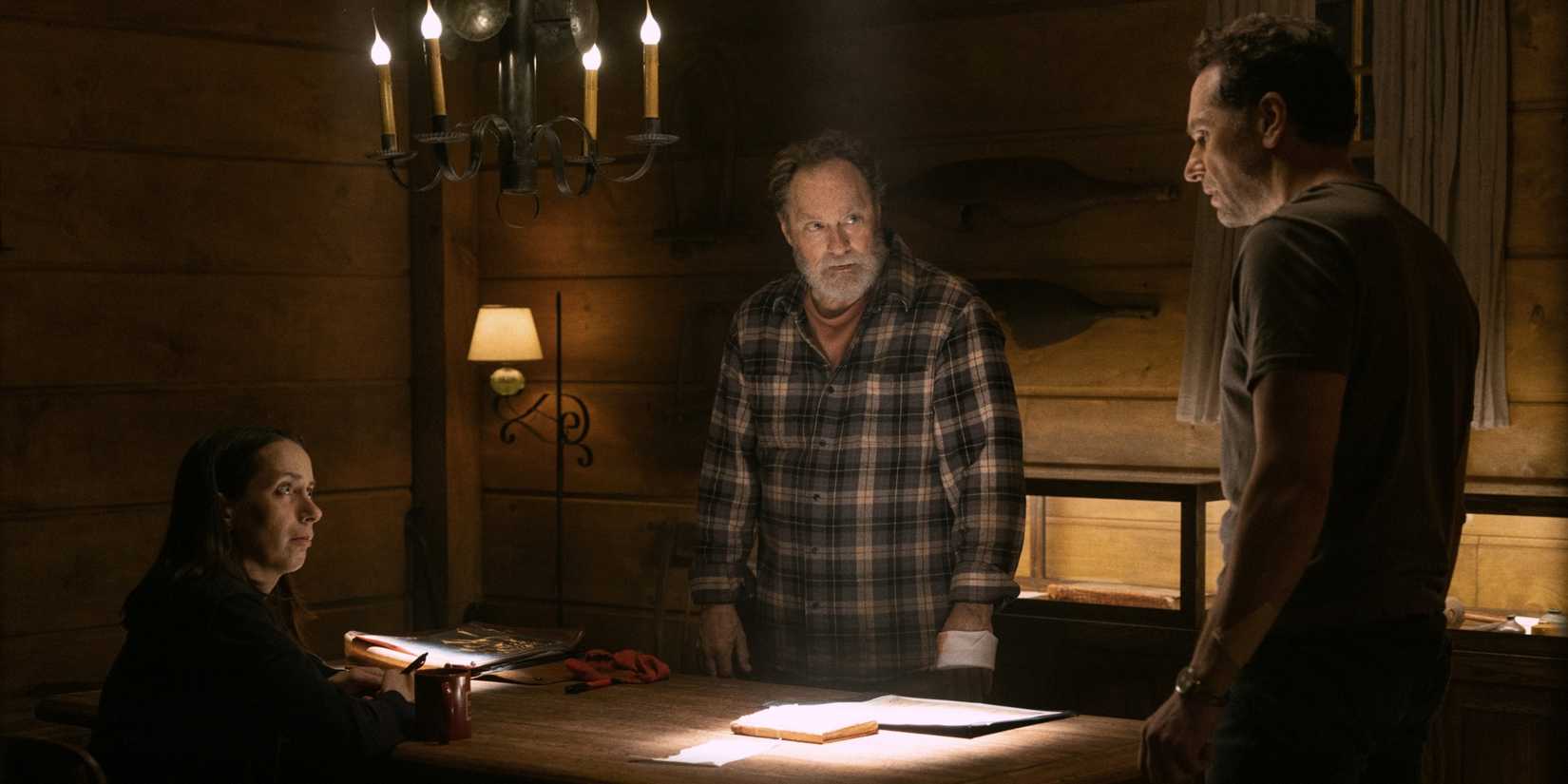 Matthew Rhys as Tom, Stephen Root as Wyck, and Kate O'Flynn as Patricia around a table in Widow's Bay