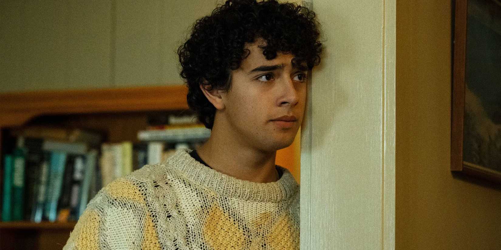 Evan Loftis (Kingston Rumi Southwick) leaning in the doorway in 'Widow's Bay'