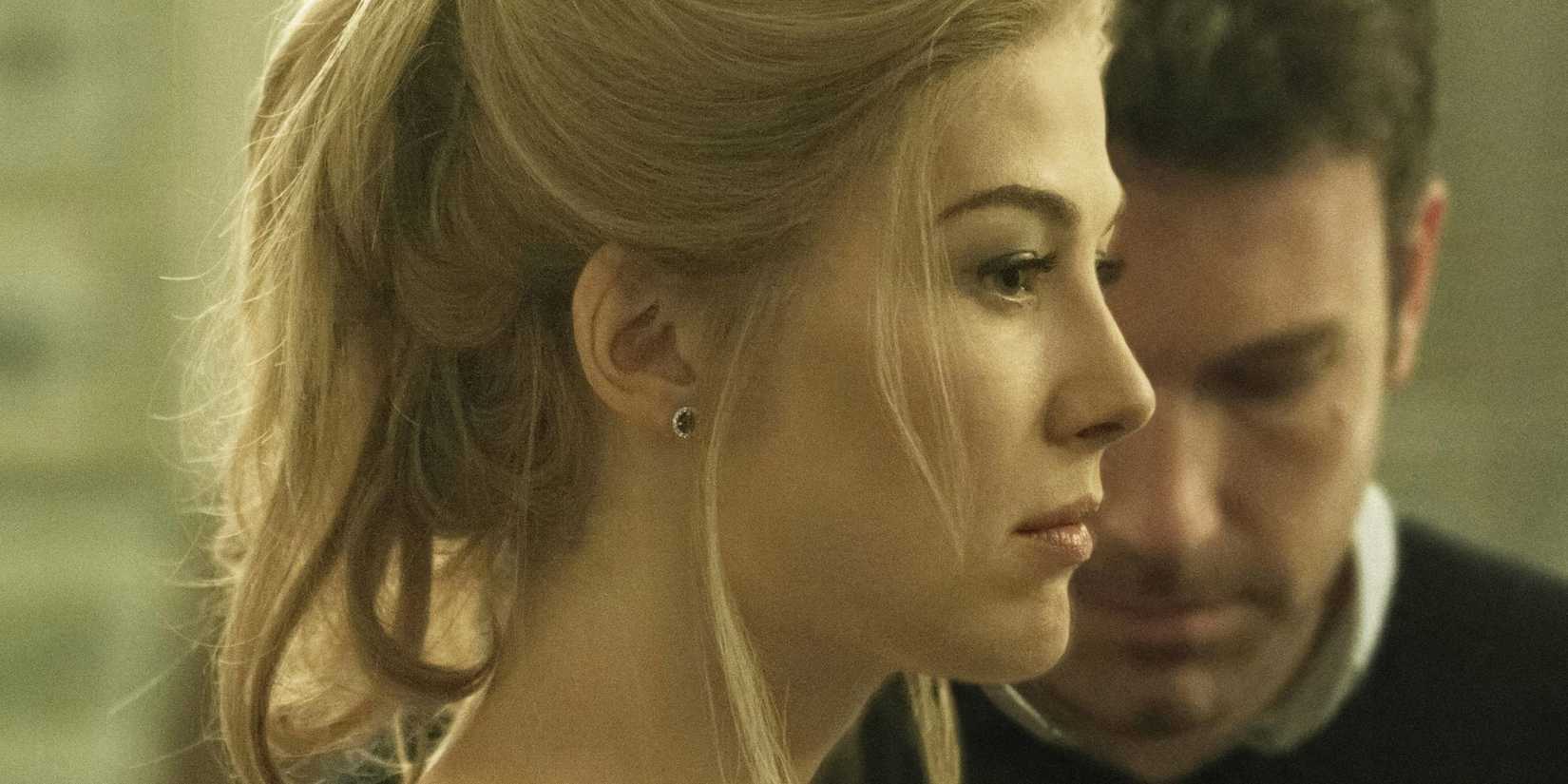Amy looking forward while Nick looks down in Gone Girl.
