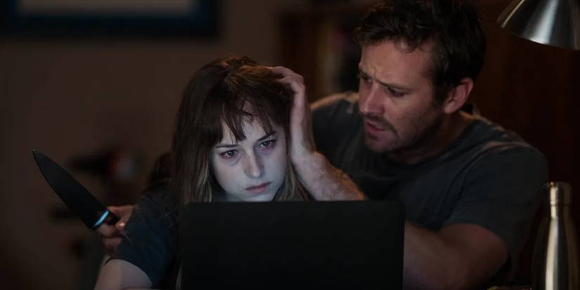 Armie Hammer with a knife and Dakota Johnson in 'Wounds' (2019)