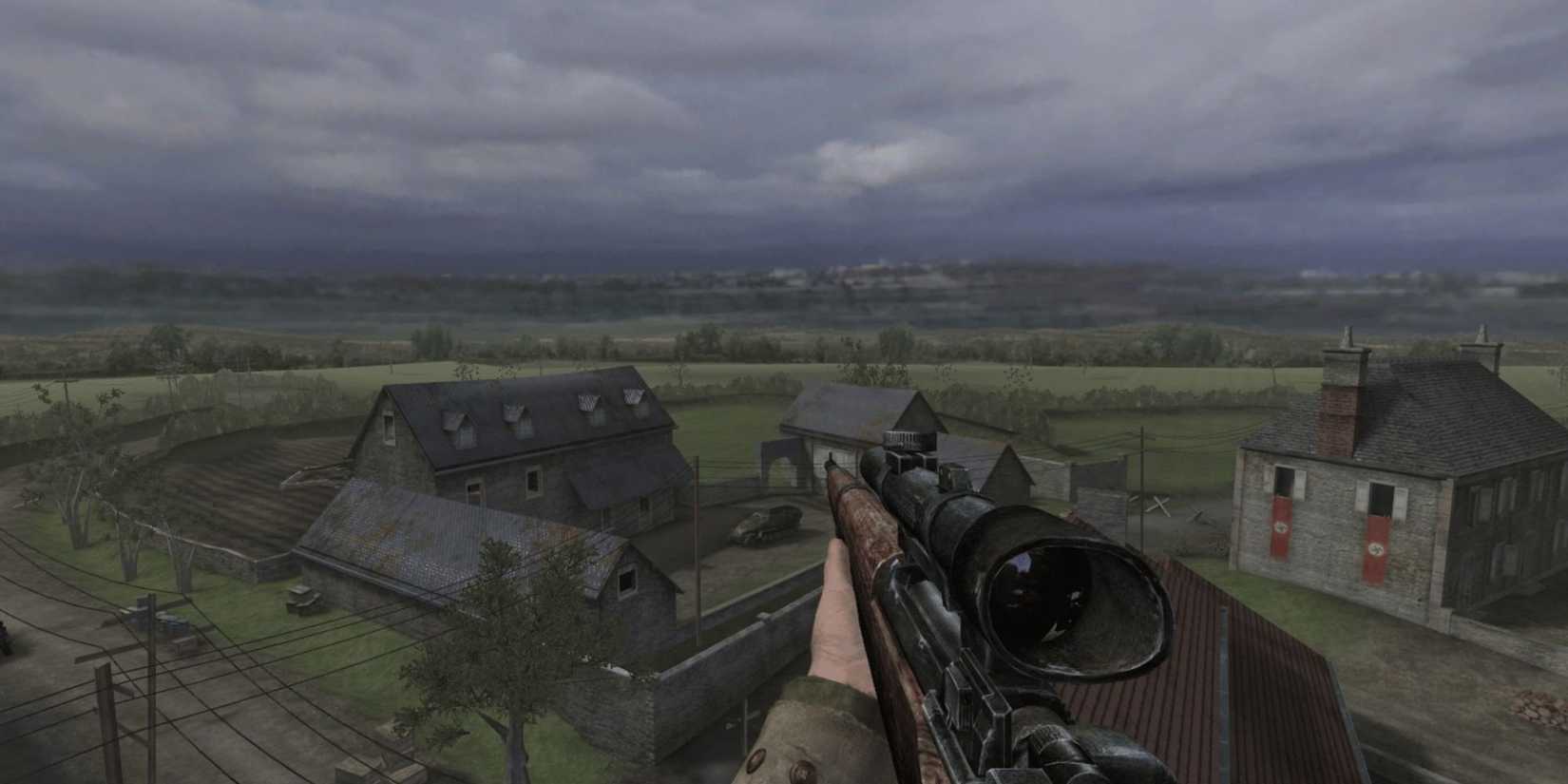 Bill Taylor, standing atop a Silo in rural France, holds a scoped Springfield rifle in 'Call of Duty 2'