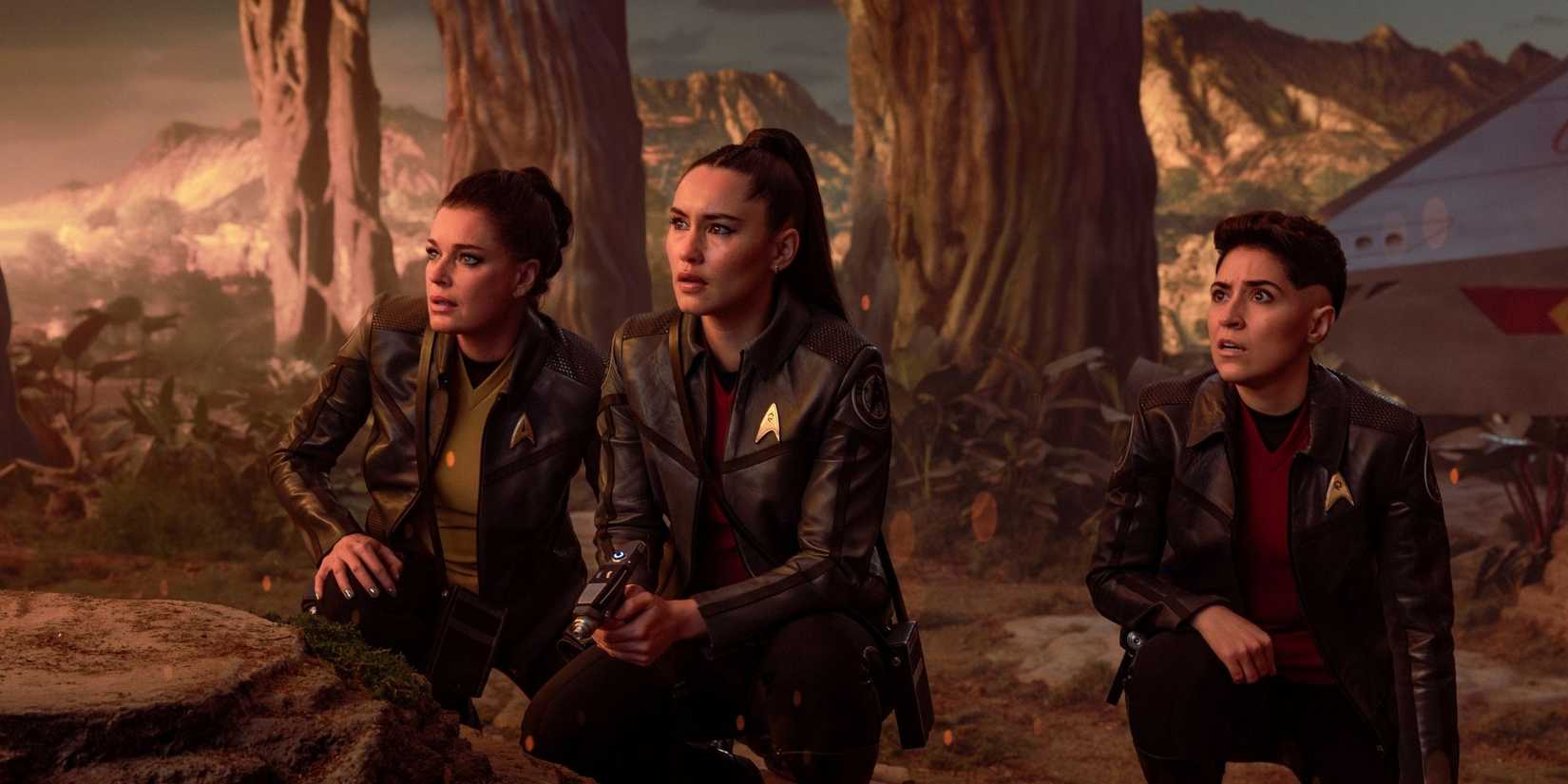 (L-R): Rebecca Romijn as Una, Christina Chong as La’an Noonien-Singh, and Melissa Navia as Erica Ortegas in season 4, episode 1, of Star Trek: Strange New Worlds streaming on Paramount+, 2026. Photo Credit: Jan Thijs/Paramount+